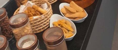 A buffet spread with various food items and condiments.