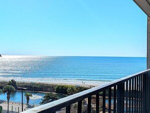 A balcony with a view of the ocean and a beach. - 2BR Tower Ocean View | Myrtle Beach Resort RT0513 (Myrtle Beach)