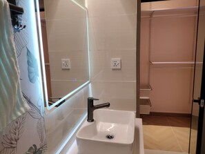 Shower, towels, soap, toilet paper