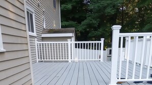 A set of outdoor steps leading to a wooden deck with white railings. - Private 4-Bedroom Oasis Near the World Cup Action—Only 9 Miles from Foxboro! (South Easton)