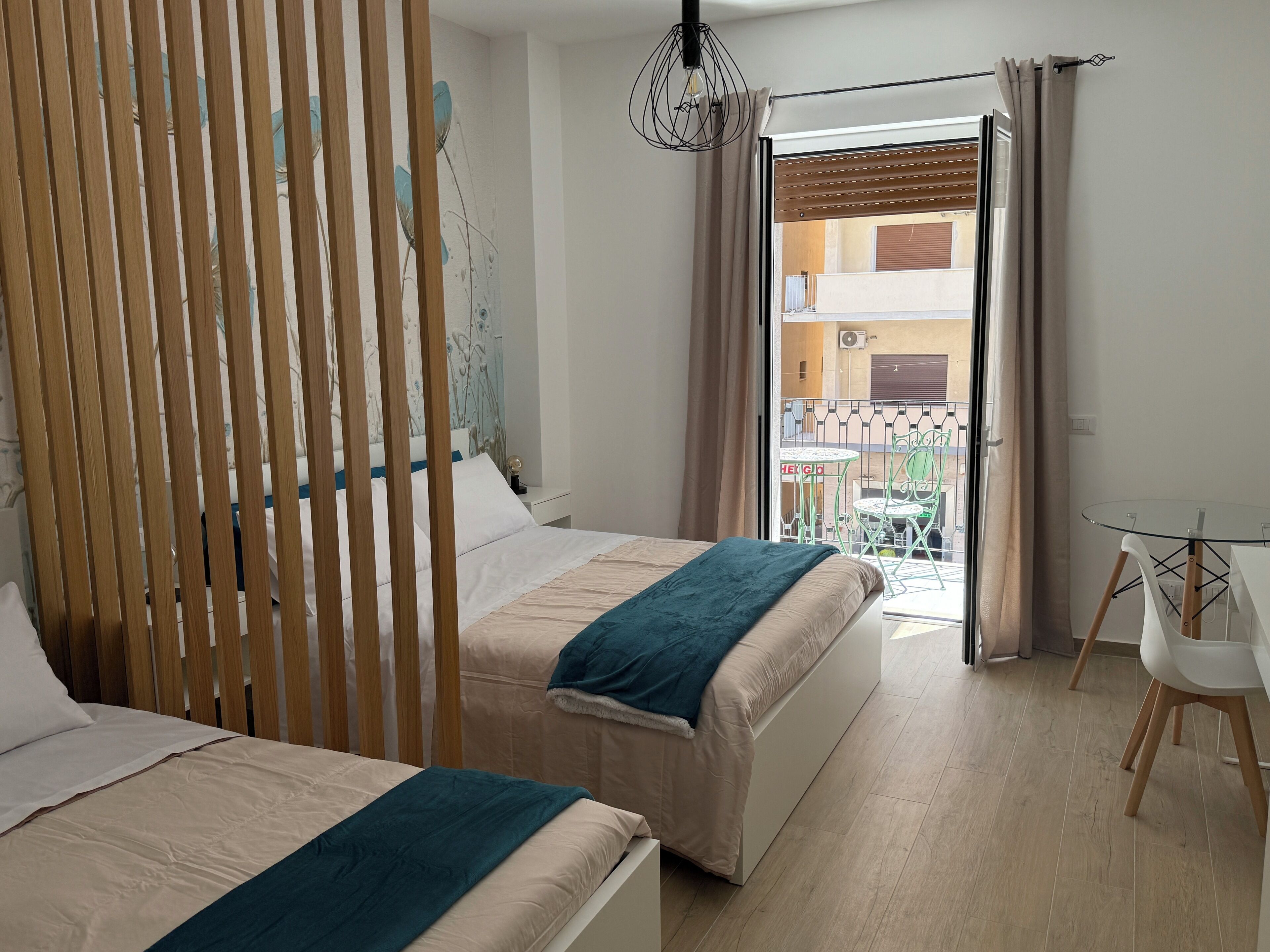 Deluxe Triple Room, Balcony, City View | Desk, laptop workspace, soundproofing, iron/ironing board