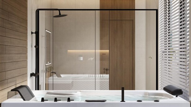 Un bany modern amb una cabina de dutxa de vidre, una banyera i un mirall gran.