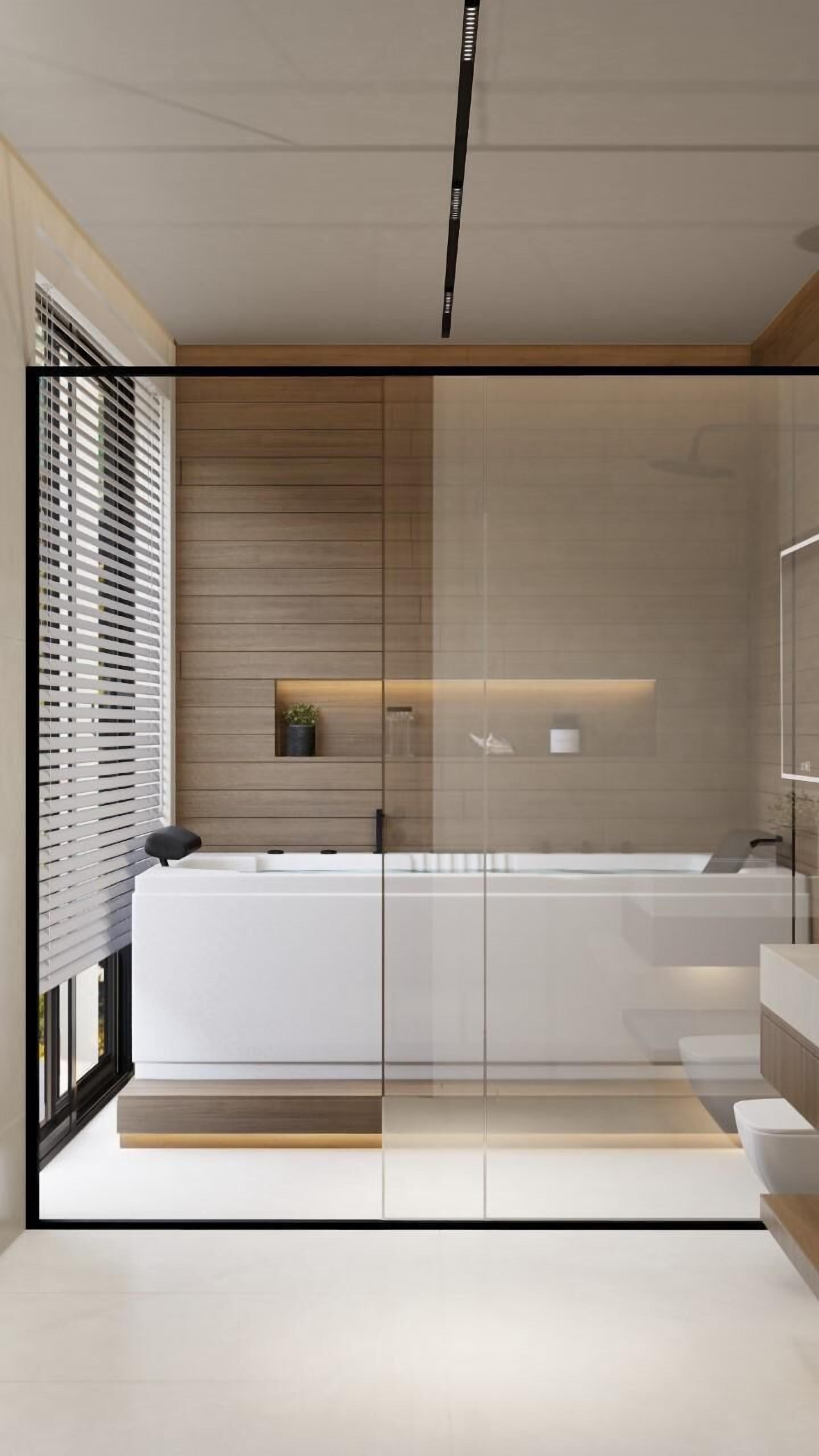A modern bathroom with a glass partition, wooden paneling, and a minimalist design.