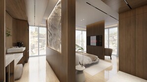 Habitació d'hotel moderna amb un gran finestral, televisió de pantalla plana, un sofà i un disseny minimalista.