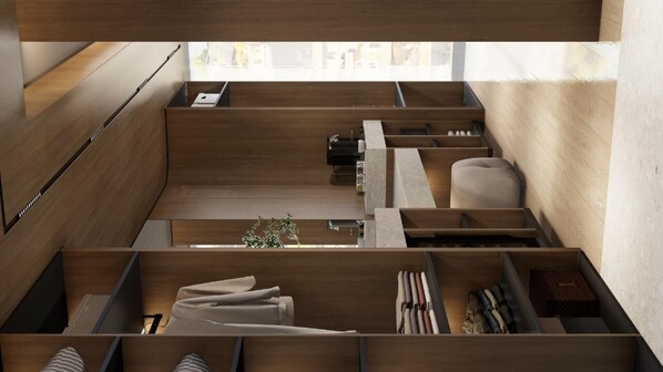 A modern, multi-level room with wooden flooring and built-in storage compartments. - Monarc Hotel (Ksamil)