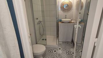 Shower, towels, soap, toilet paper