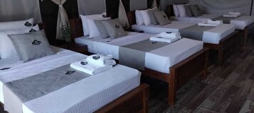 Standard Quadruple Room | Desk, laptop workspace, blackout drapes, iron/ironing board
