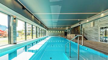 Indoor pool, open 9:00 AM to 9:00 PM, pool loungers, lifeguards on site