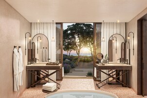 Separate tub and shower, rainfall showerhead, designer toiletries