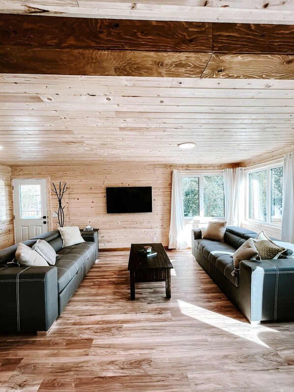 Cabaña, vista al resort | Área de sala de estar