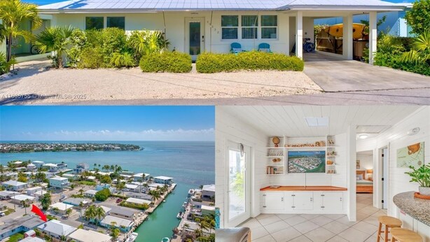 Una casa costera con porche cubierto, vista al mar y cocina amplia con armarios blancos y encimera de madera.