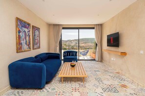 Suite estudio Premium | Área de sala de estar