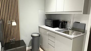 Fridge, microwave, stovetop, cookware/dishes/utensils