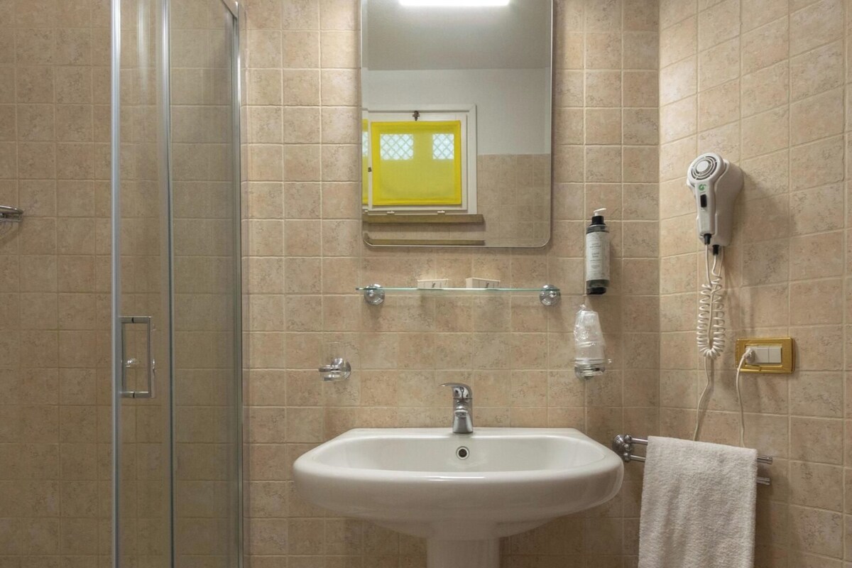 Bathroom | Shower, hair dryer, bidet, towels