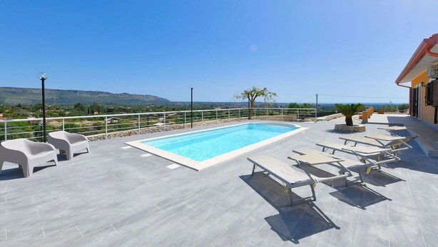 A rooftop pool with a clear view of the landscape, surrounded by lounge chairs and a railing. - PANORAMA - Elegant villa in a panoramic position! (Floridia)