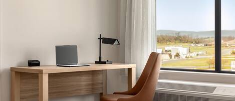Desk, laptop workspace, blackout drapes, iron/ironing board