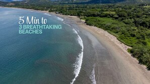 An aerial view of a beach with text overlay indicating '5 Min to 3 Breathtaking Beaches'. - King Suite w Pool + Game Room + 5 min. to the Beach (Potrero)
