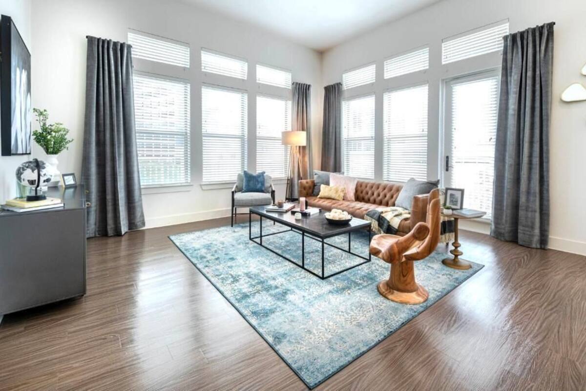 Family Apartment, Balcony, City View | Living area | 50-inch Smart TV with digital channels