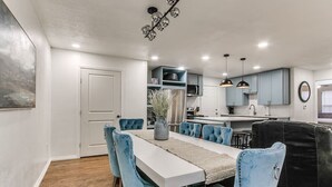 A modern kitchen with a central island, built-in appliances, and pendant lighting. - Beautiful 2-Bedroom Near Wheeler (Oklahoma City)
