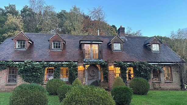 A traditional brick house with a steeply pitched roof, multiple windows, and a large front door. - Elegant Hampshire Countryside Stay, Petersfield (Petersfield)