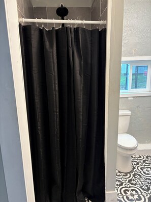 Shower, towels, soap, toilet paper