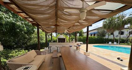 Lakefront family retreat in a private gated community. Pool, sauna and BBQ area