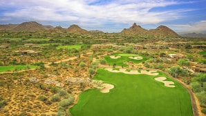 A golf course with bunkers, a desert landscape, and distant mountains. - Scottsdale Golf Retreat at Troon North (Scottsdale)