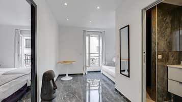 1 bedroom, desk, iron/ironing board, travel crib