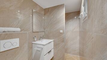 Shower, eco-friendly toiletries, hair dryer, towels