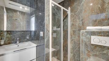 Shower, eco-friendly toiletries, hair dryer, towels