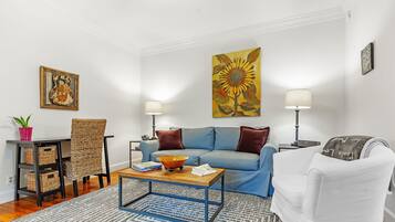 New Orleans Luxury Suite, 1 King Bed, Pets Allowed, Courtyard View | Living area | 43-inch Smart TV with digital channels, toys, books