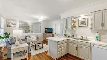 Magnolia Luxury Suite, 1 King Bed, Pets Allowed, Bay View | Living area | 43-inch Smart TV with digital channels, toys, books