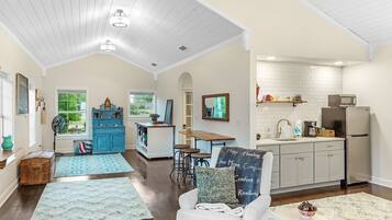 Lotus Luxury Suite, 1 King Bed, Kitchenette, Bay View | Living area | 43-inch Smart TV with digital channels, toys, books