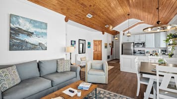 Azalea Luxury Suite, 2 Bedrooms, Bay View | Living area | 43-inch Smart TV with digital channels, toys, books