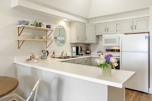 Luxury Suite, 2 Bedrooms, Pets Allowed, Ground Floor | Private kitchen | Microwave, coffee/tea maker, highchair - Jubilee Suites Boutique B&B (Fairhope)