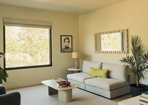 Standard Suite | Living area | 50-inch Smart TV with digital channels, streaming services