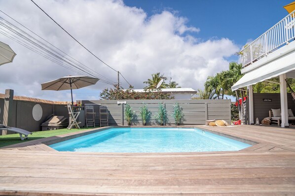 Outdoor pool, pool umbrellas, pool loungers