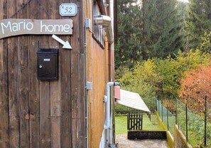 A wooden building with a sign reading "Mario home" and a mailbox. - Mario home (Tarvisio)