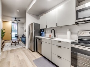 Fridge, microwave, oven, stovetop - Midtown Luxe 1 Bed Apt (Oklahoma City)