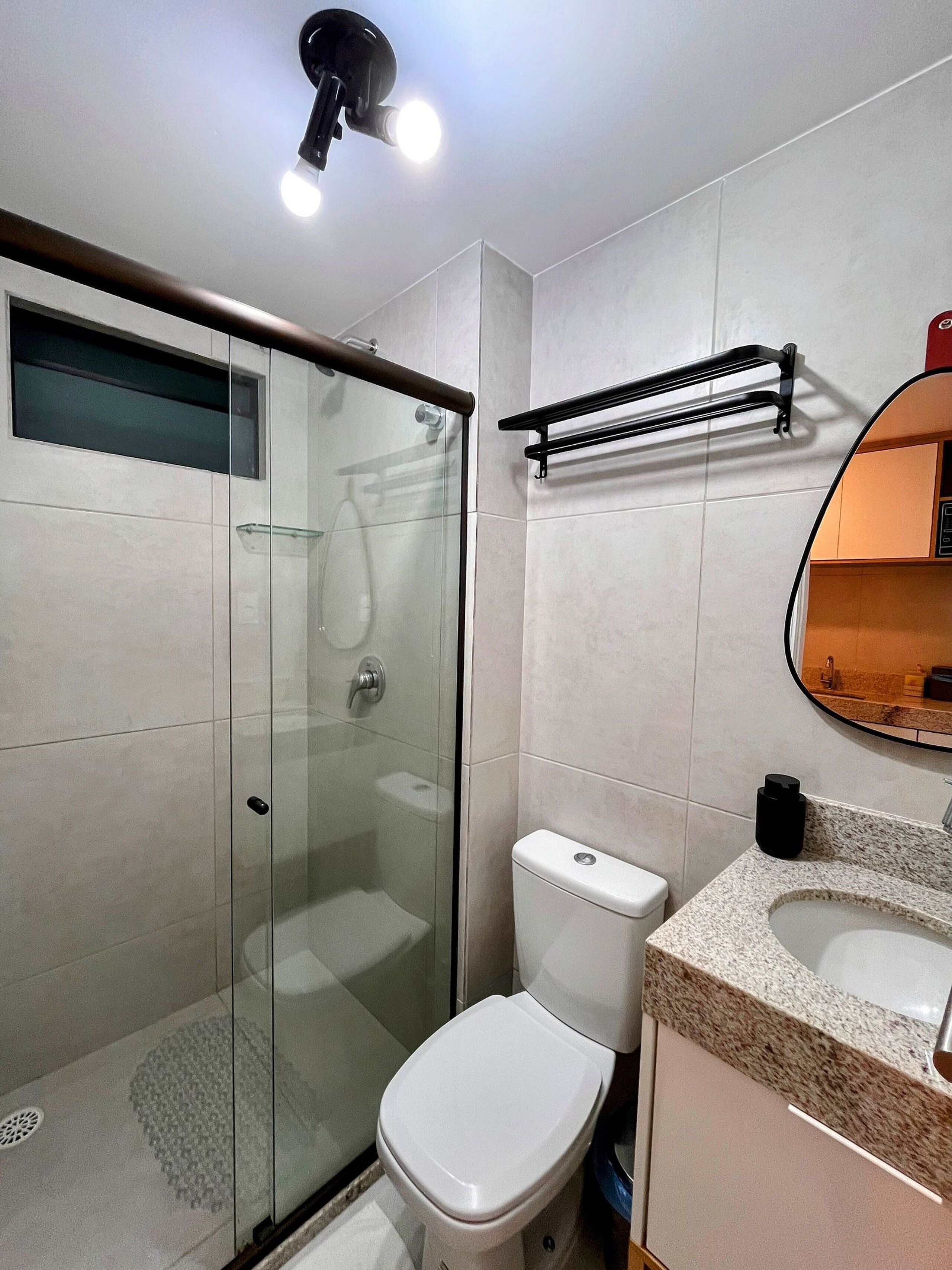 Basic Studio | Bathroom | Shower, towels, soap, toilet paper