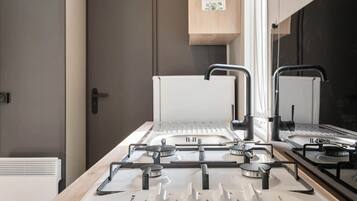 Fridge, microwave, coffee/tea maker, cookware/dishes/utensils