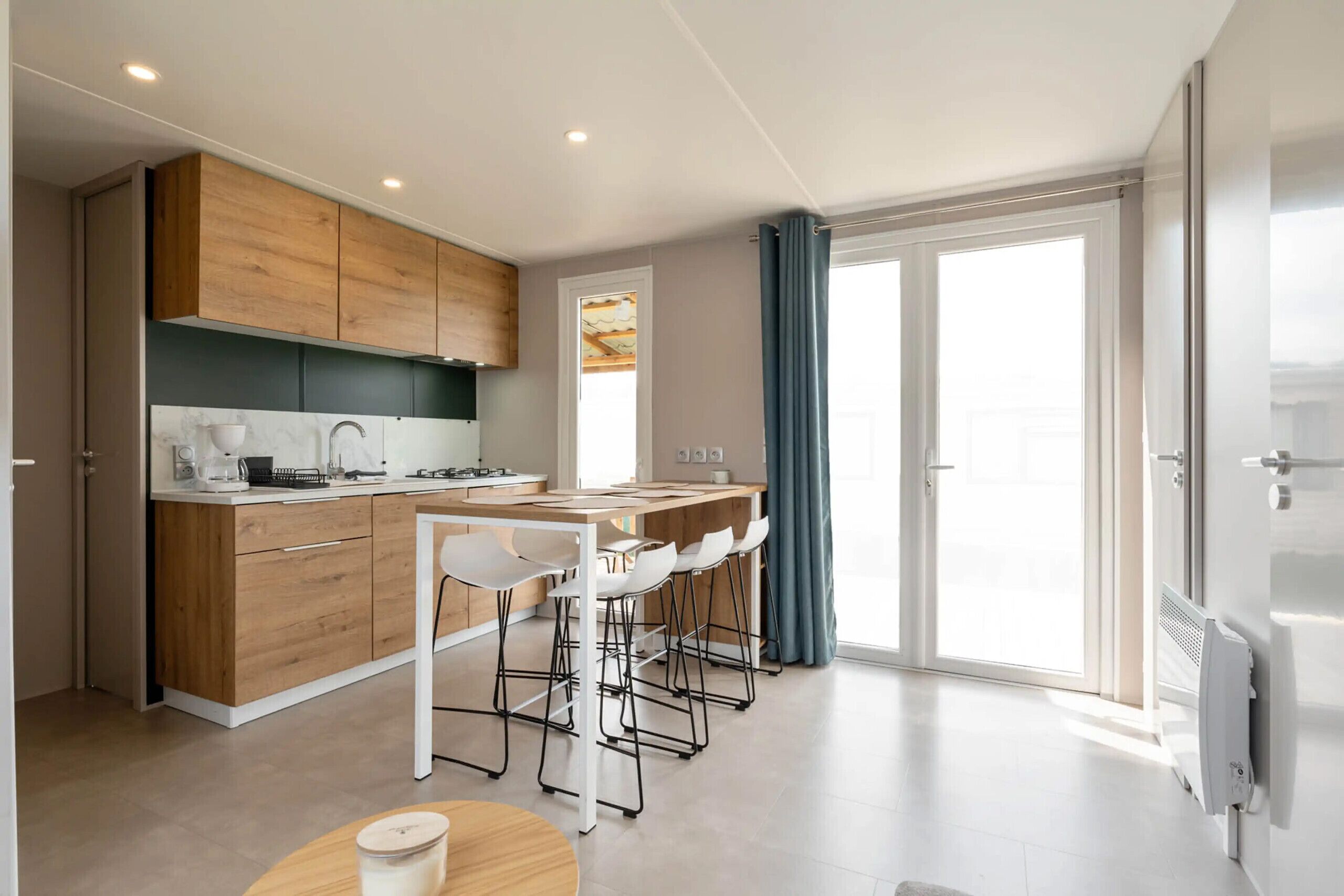 Fridge, microwave, coffee/tea maker, cookware/dishes/utensils