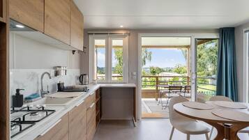 Fridge, microwave, coffee/tea maker, cookware/dishes/utensils