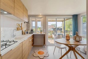 Fridge, microwave, coffee/tea maker, cookware/dishes/utensils