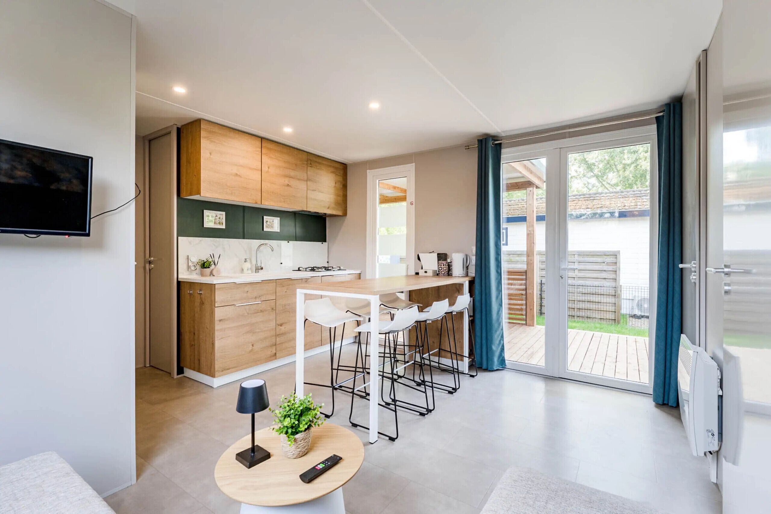 Fridge, microwave, coffee/tea maker, cookware/dishes/utensils