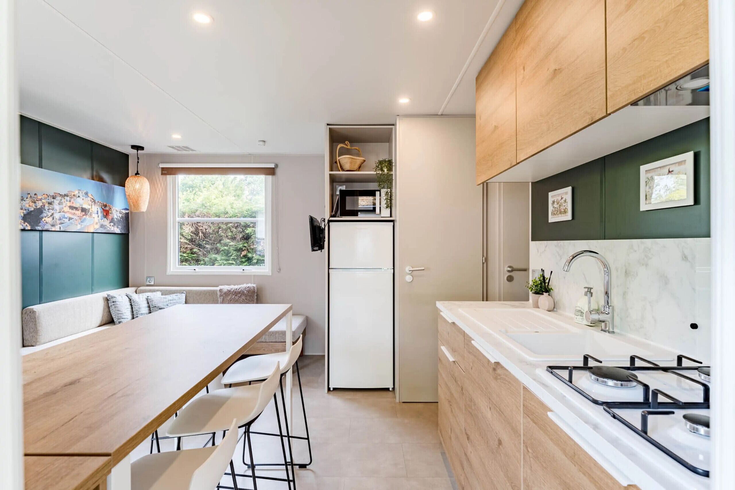 Fridge, microwave, coffee/tea maker, cookware/dishes/utensils