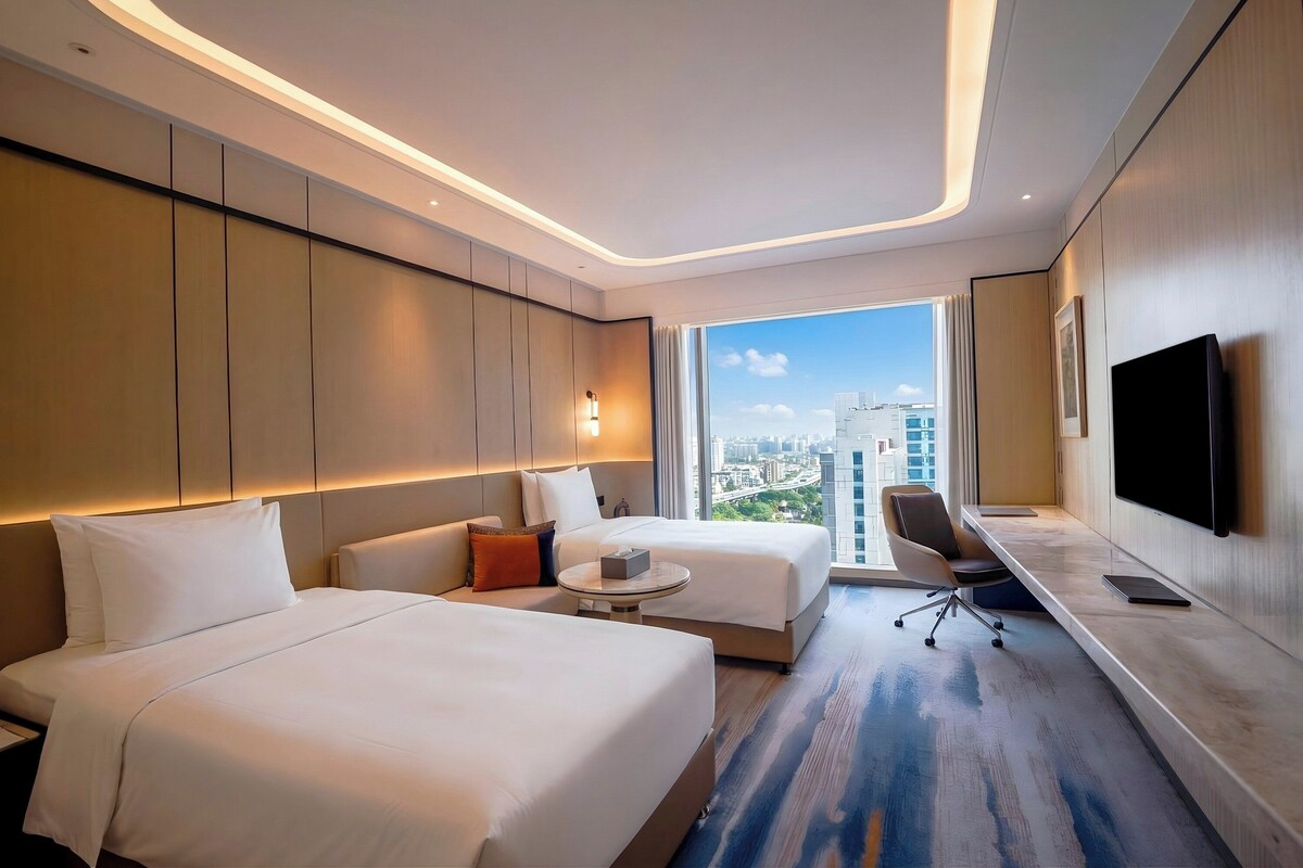 Premium bedding, desk, laptop workspace, soundproofing