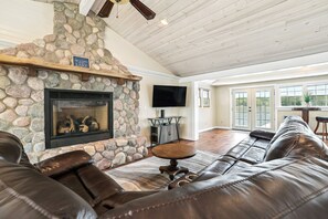 TV, fireplace - Lakefront Gladwin Vacation Rental w/ Deck & Dock! (Gladwin)