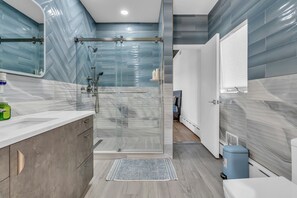 Shower, hair dryer, towels, soap