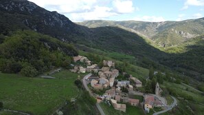 A village with stone buildings, narrow roads, and surrounding hills. - Rural Vacation Rental - Your Gateway to the Spanish Pyrenees (Calvera)